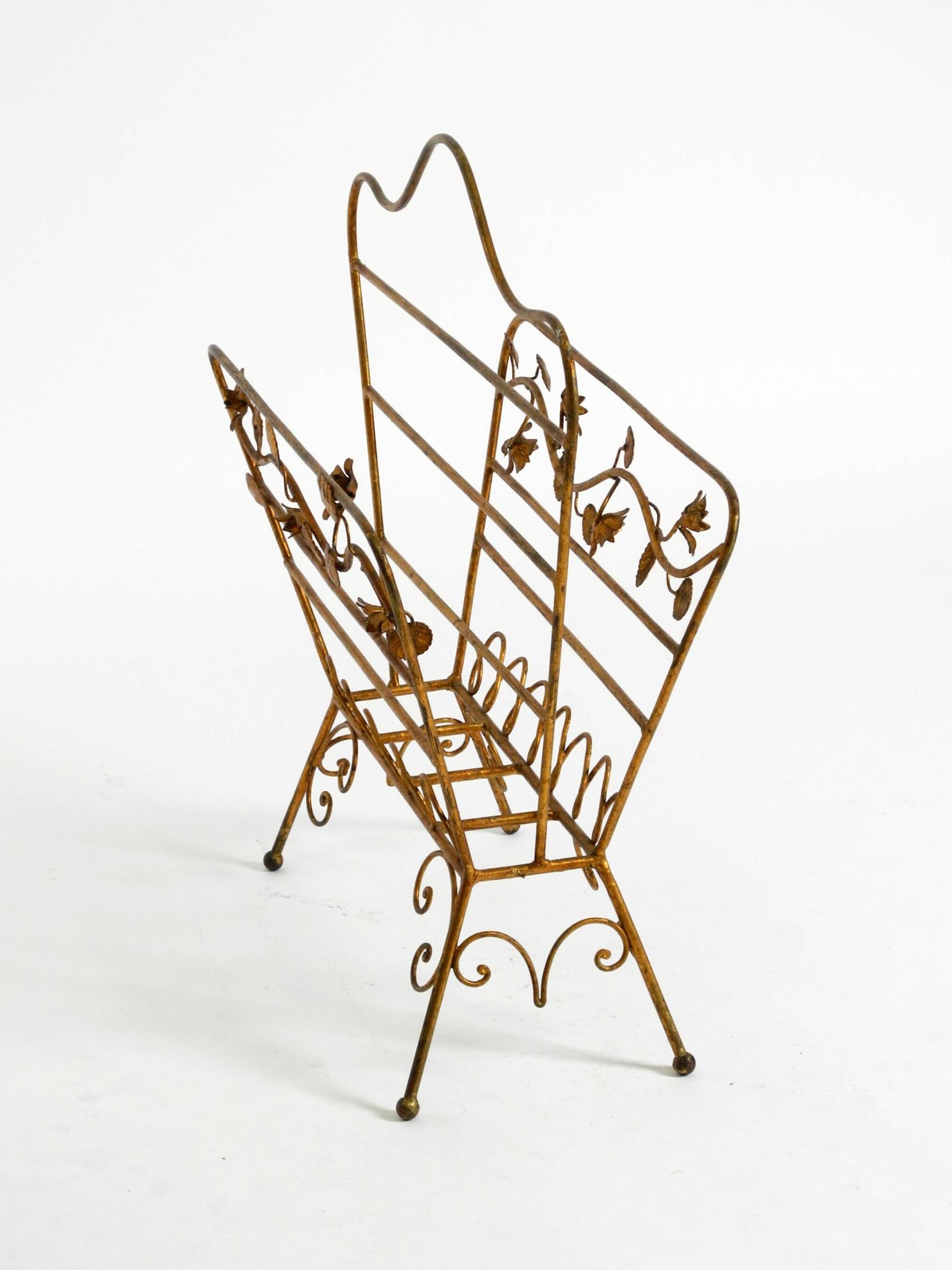 Extraordinary mid-century newspaper and magazine rack with a gilded metal