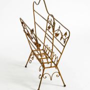 Extraordinary mid-century newspaper and magazine rack with a gilded metal