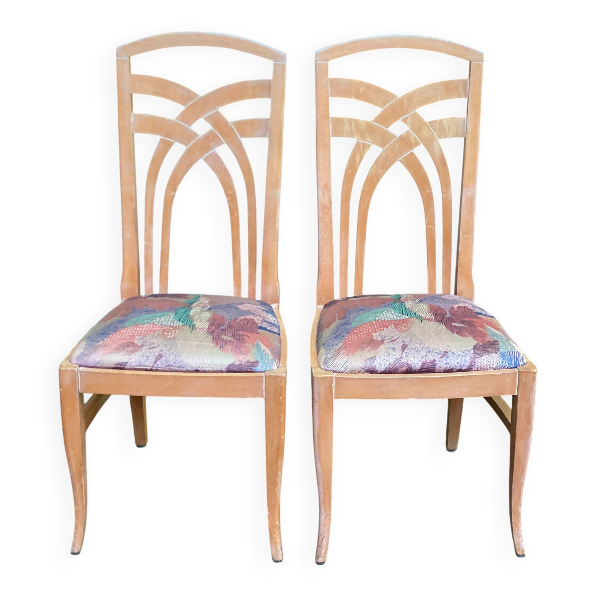 2 dining or kitchen chairs with high backs and fabric.