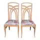 2 dining or kitchen chairs with high backs and fabric.