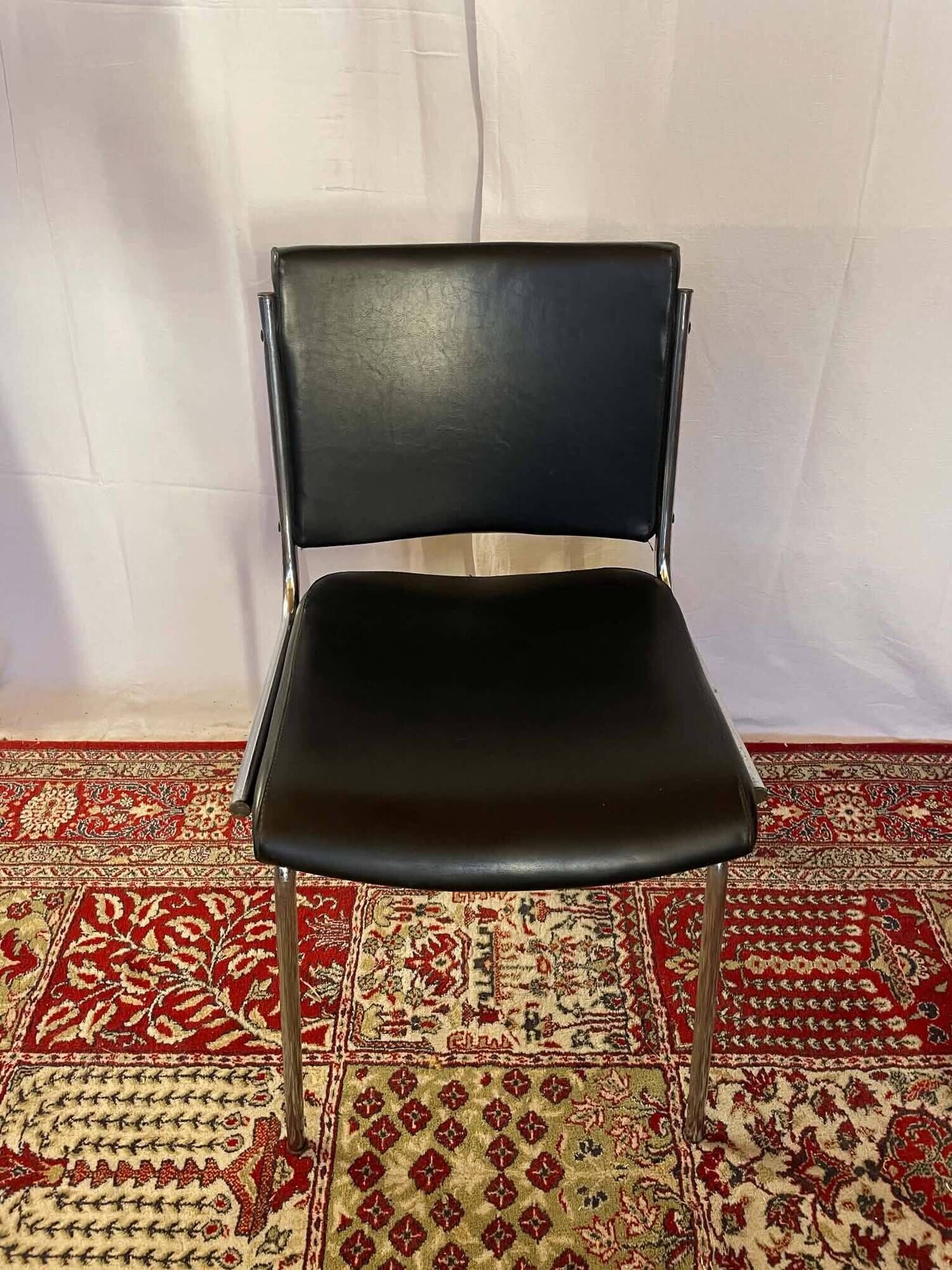 Vintage chair in black faux leather and chrome metal