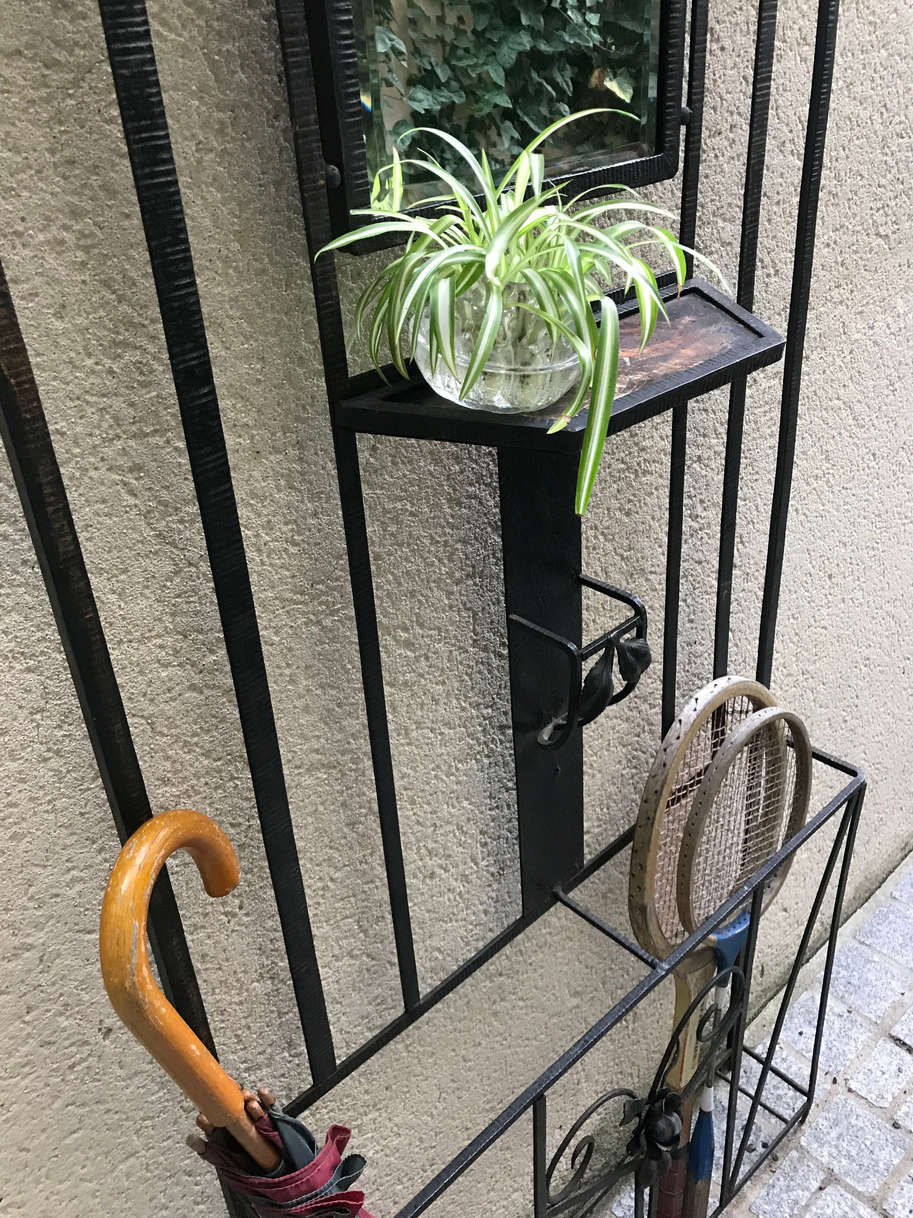 Wrought iron coat holder with 1930