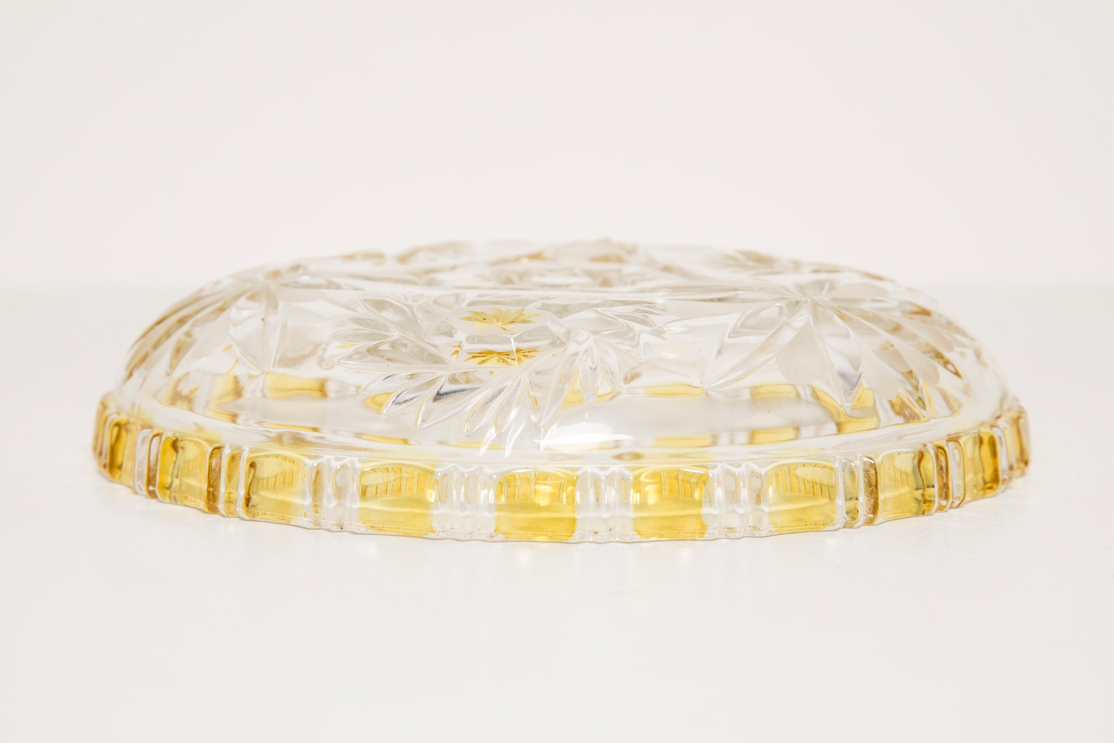 Decorative plate in transparent and vintage yellow glass, Italy, 1960s.