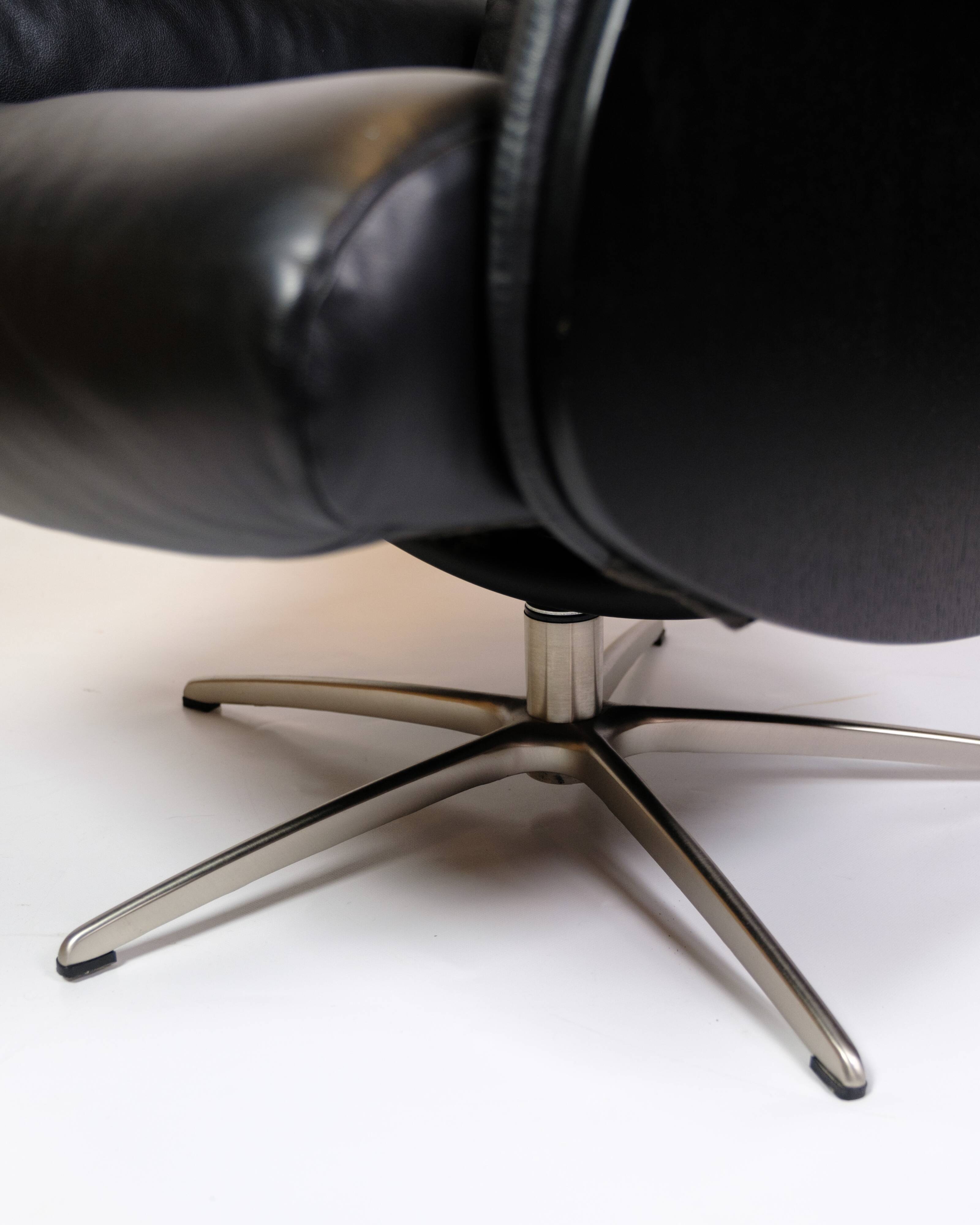 Lounge chair made in black leather & aluminium swivel from 1970s