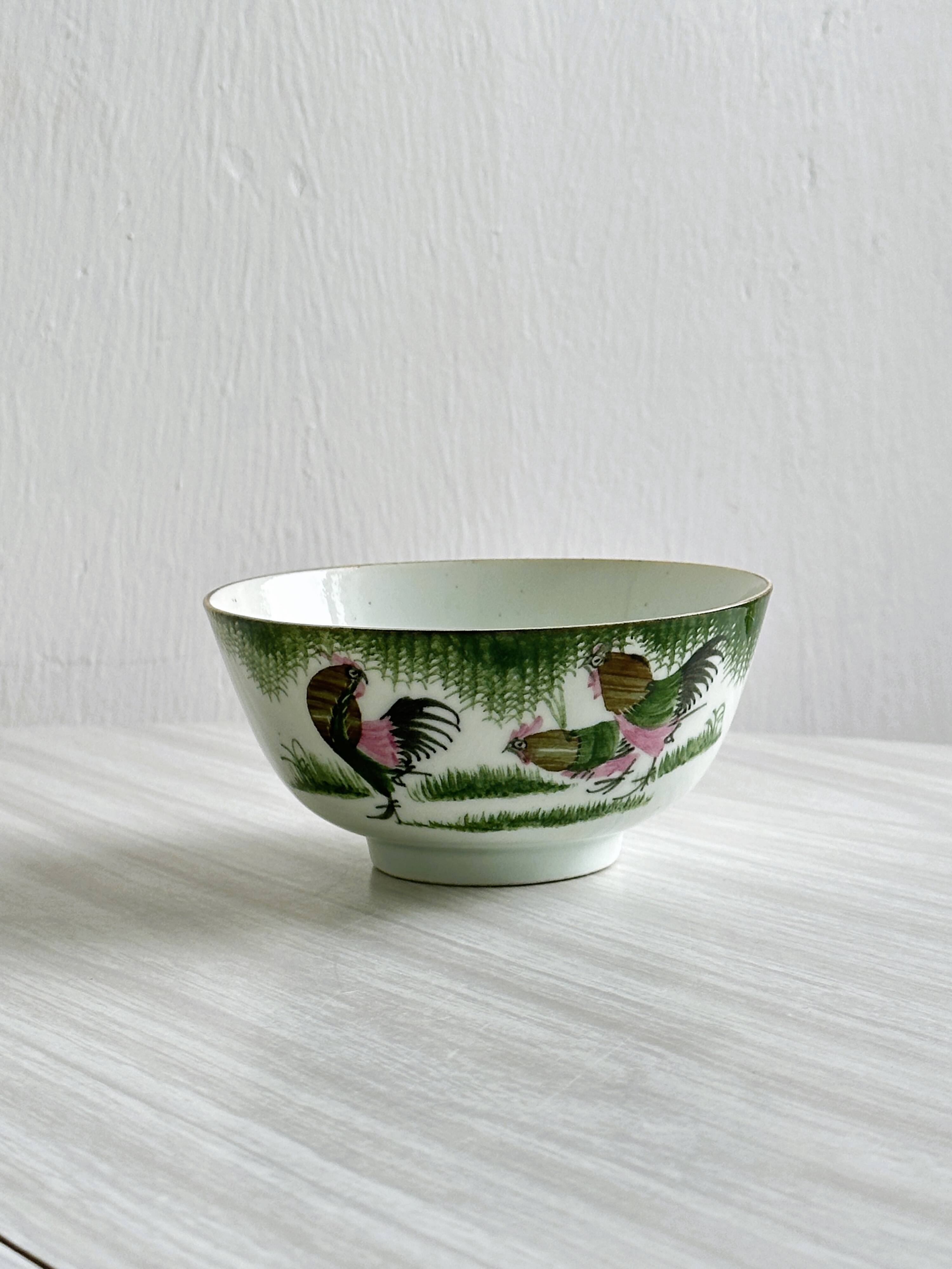 Antique porcelain bowl with rooster motif