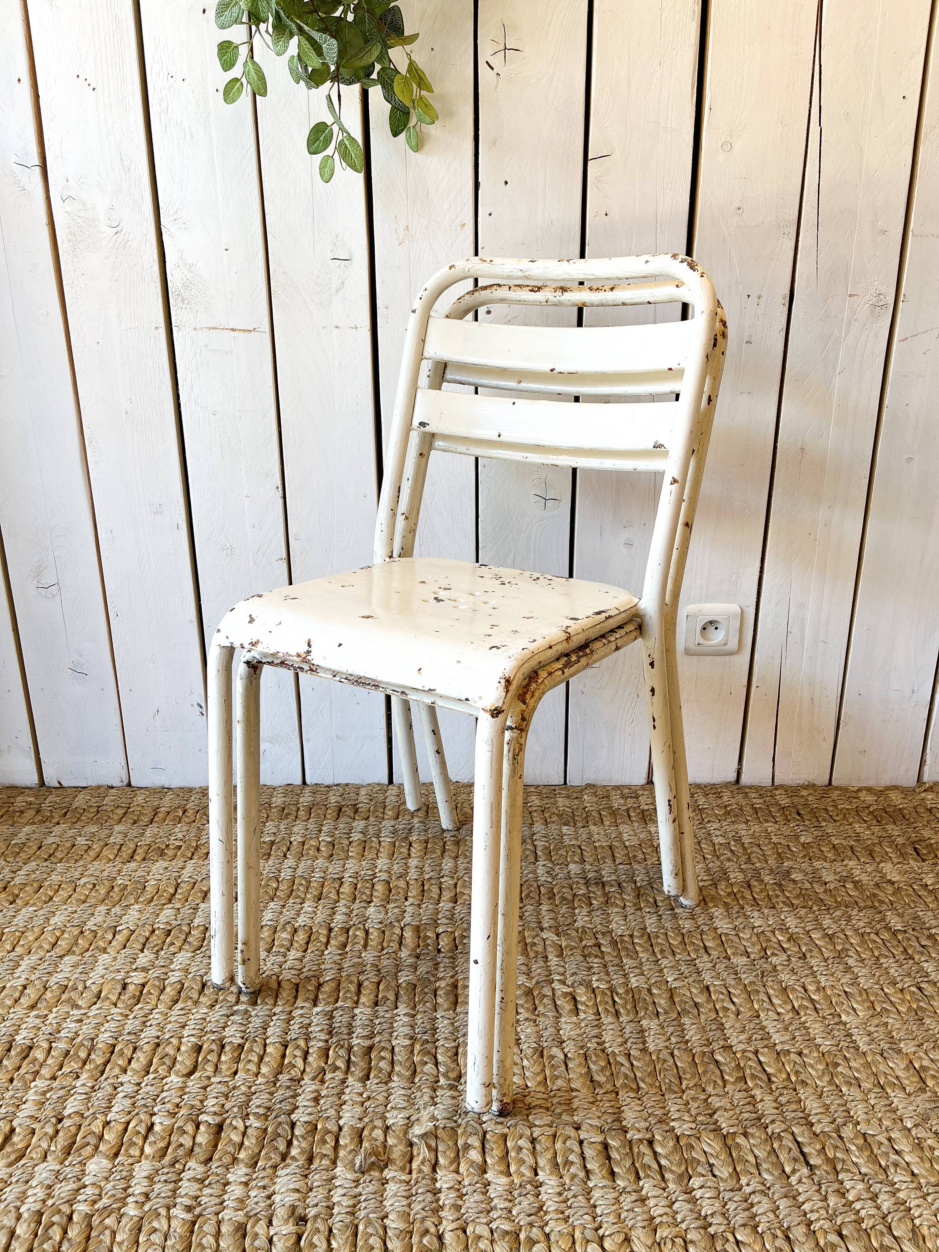Pair of white metal bistro chairs