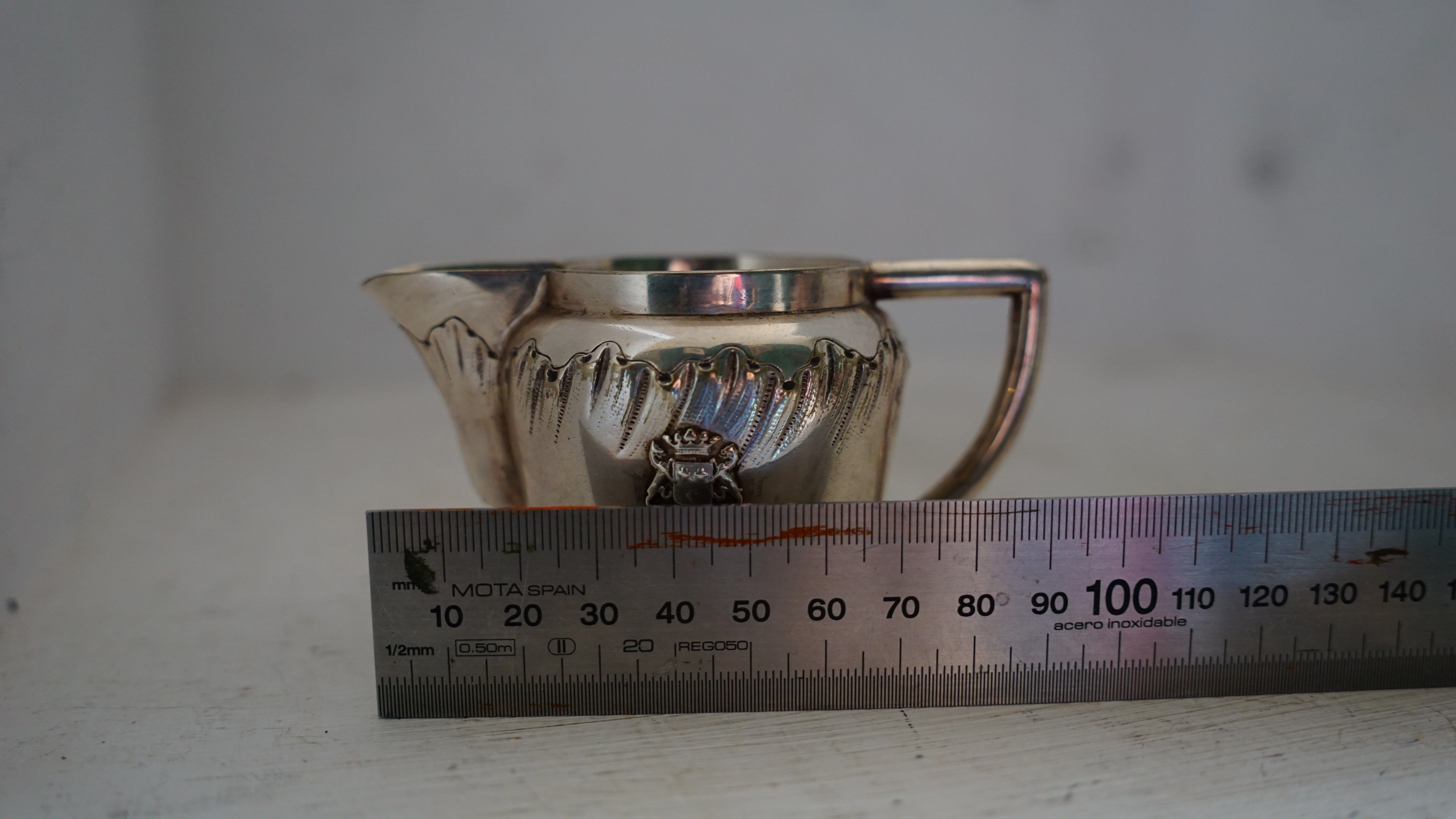 Teapot and milk jug English silverware