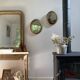Oval mirror in gilded wood