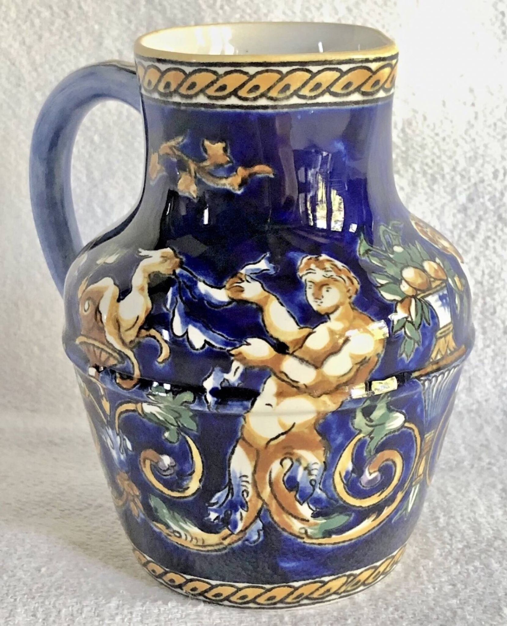 Old cream jug Gien Renaissance blue background 1938/1960