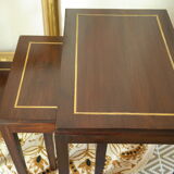 Pull-out tables in mahogany and vintage brass