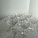 Set of seven blown glass stemmed glasses.