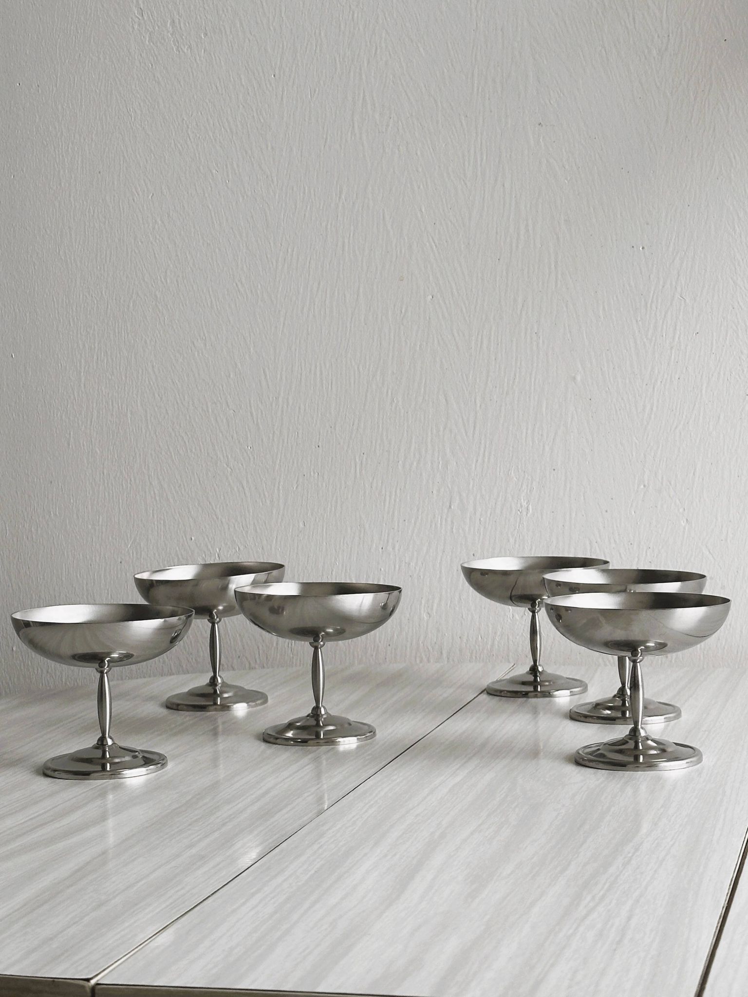 6 stainless steel dessert bowls on foot