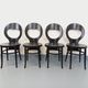 Set of 4 vintage Mouette chairs by Baumann in black wood from the 1960s.