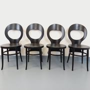 Set of 4 vintage Mouette chairs by Baumann in black wood from the 1960s.