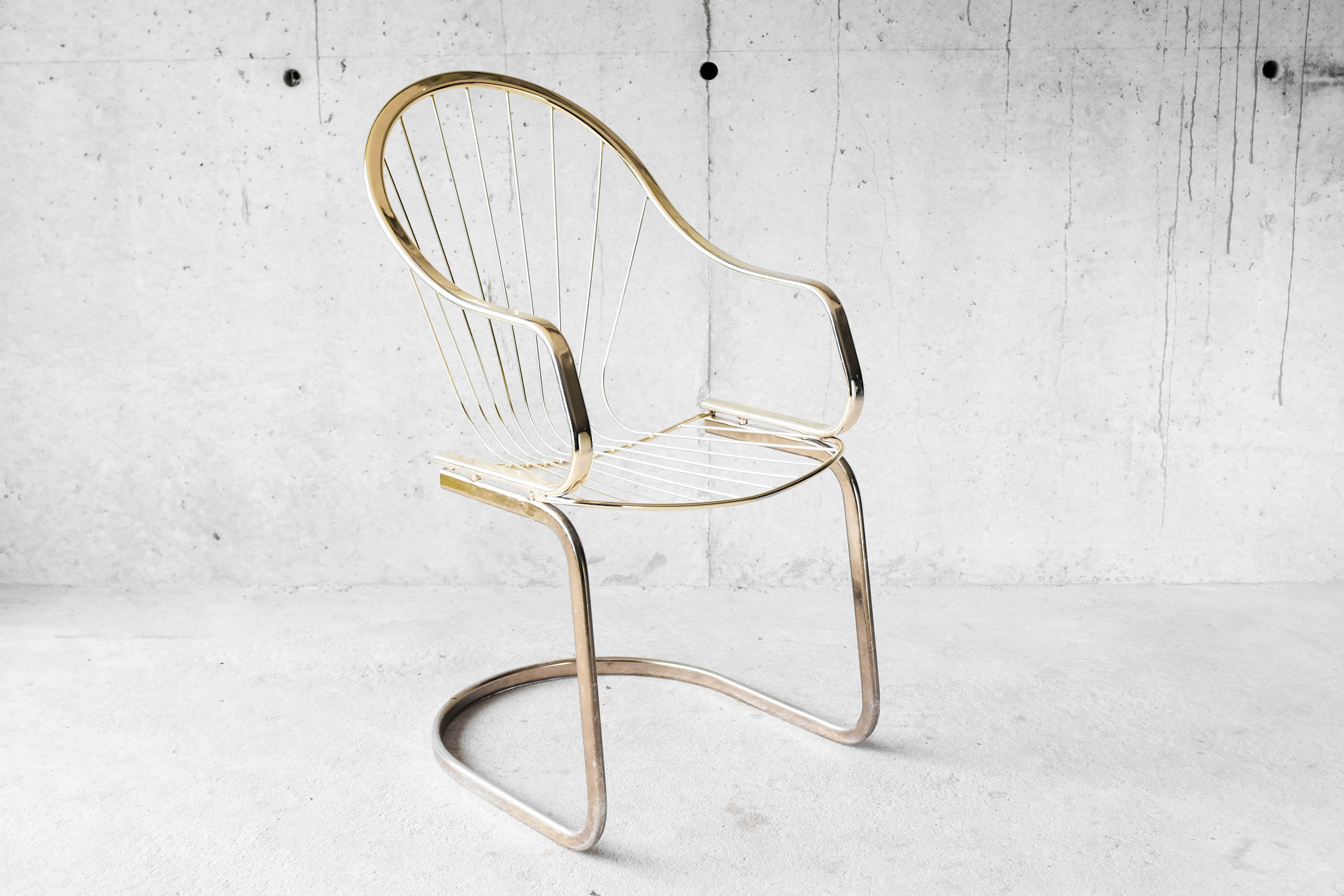 Golden metal armchair 70s