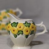 Sunflower flower cups and milk jug
