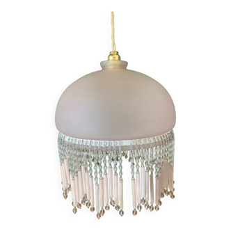 Globe pendant with pink tassels
