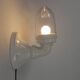 Wall lamp in porcelain with a transparent glass shade, 1930s.