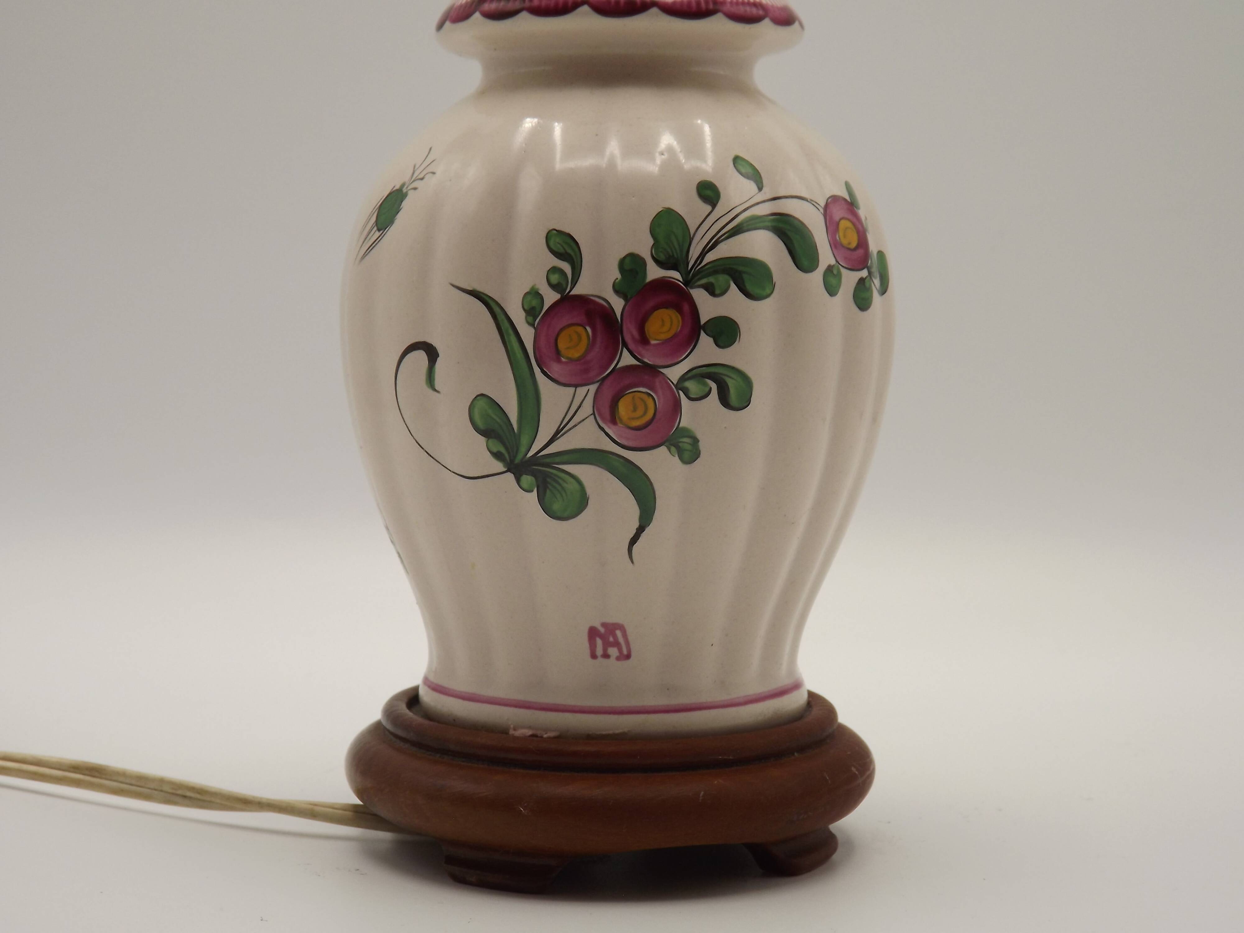 Pretty French vintage hand-painted ceramic floral lamp base on wooden plinth.