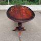 Glossy mahogany dining table in English Regency style from the 1970s.