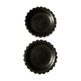 Two undersides of Napoleon III bottles in boiled cardboard