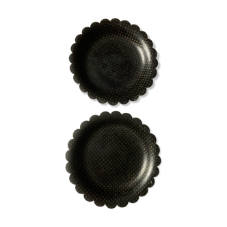 Two undersides of Napoleon III bottles in boiled cardboard