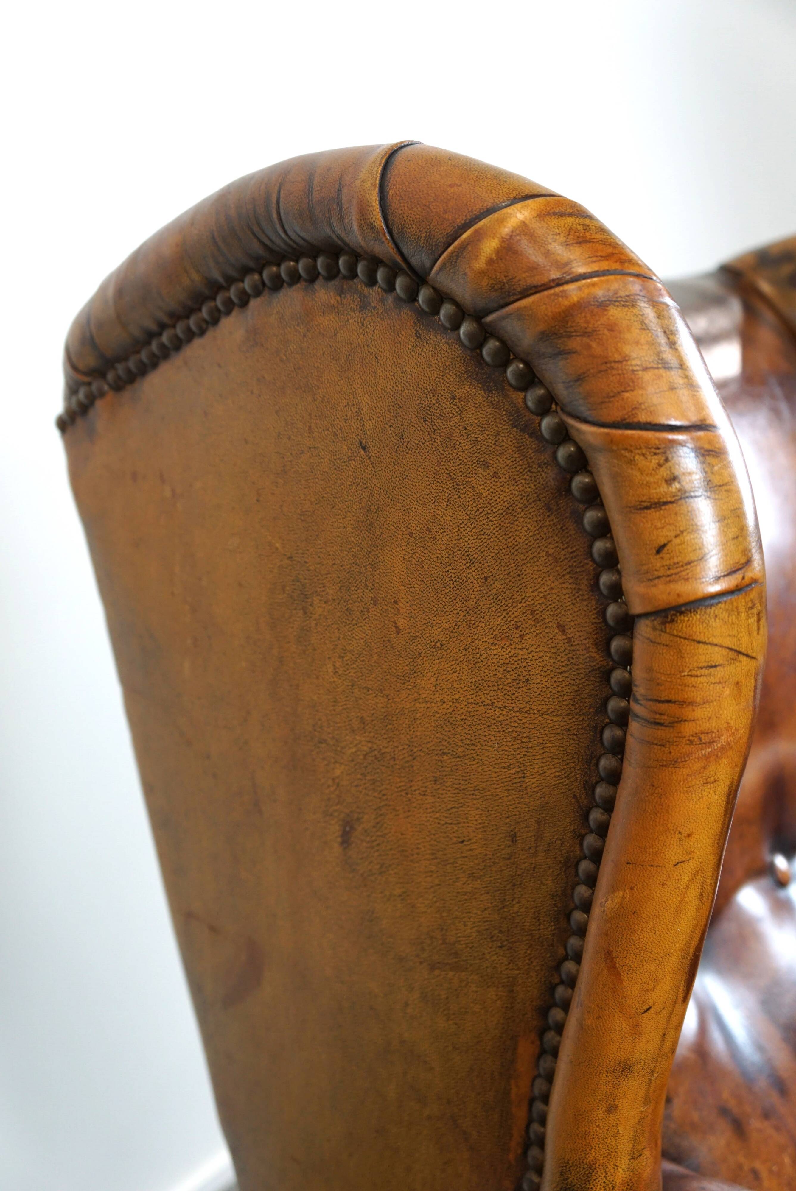 Irresistible old sheep leather wingback armchair with the most beautiful colors