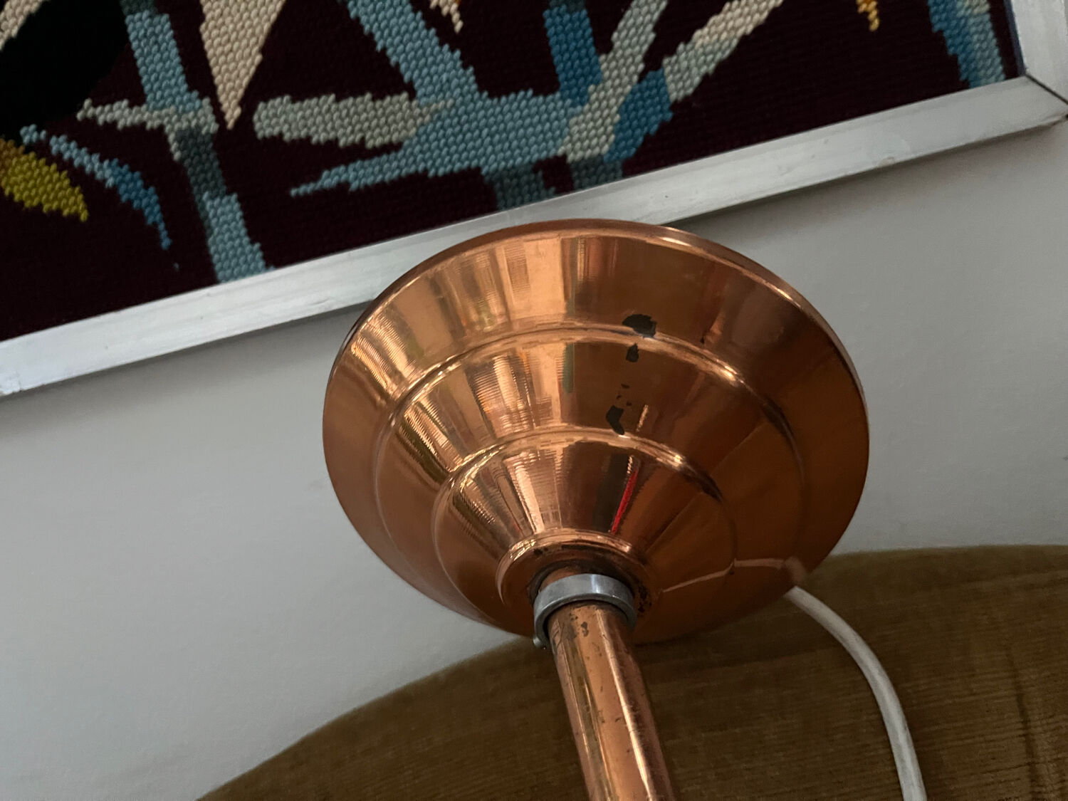 Opaline white globe pendant light with metal stem, Art Deco style.