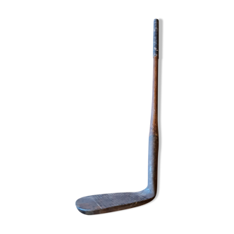 Wood, leather and metal golf club