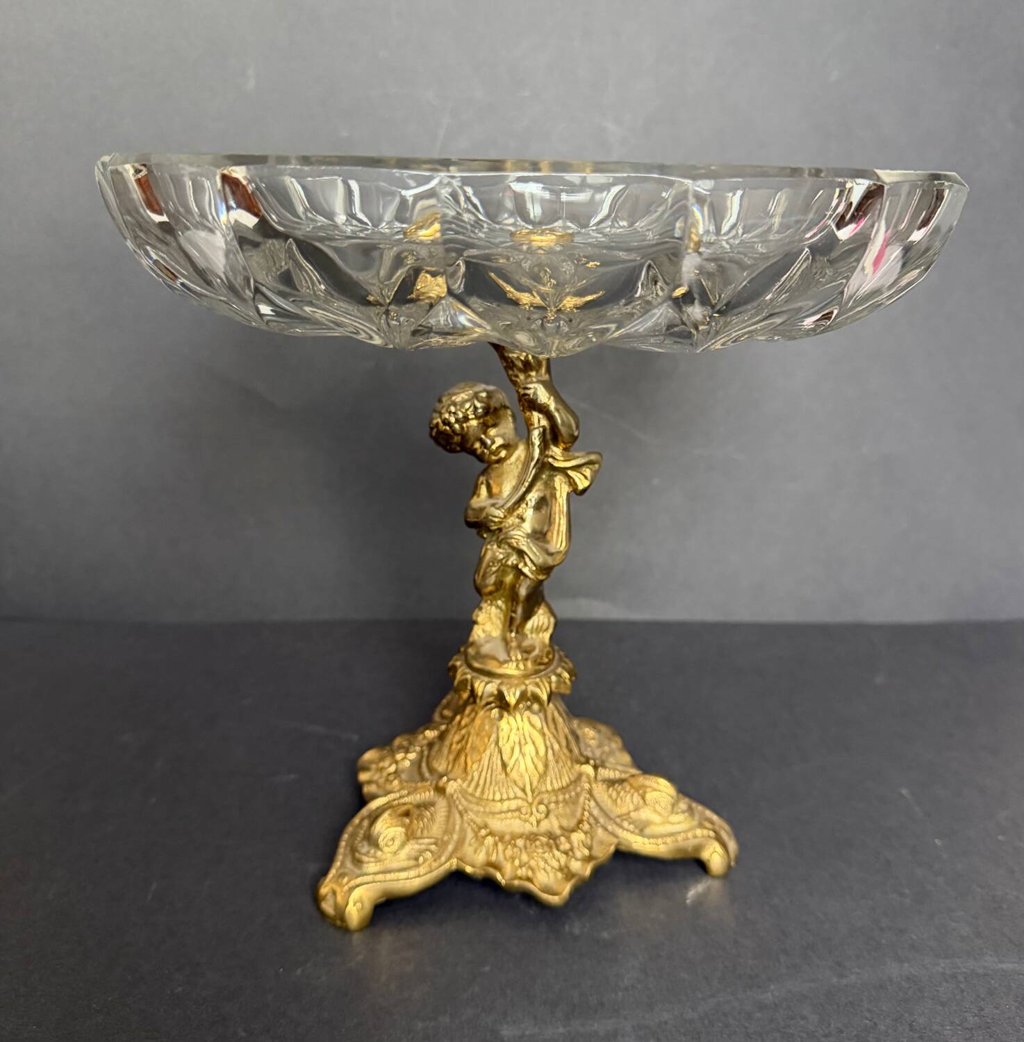 Antique crystal bowl on a bronze stand.