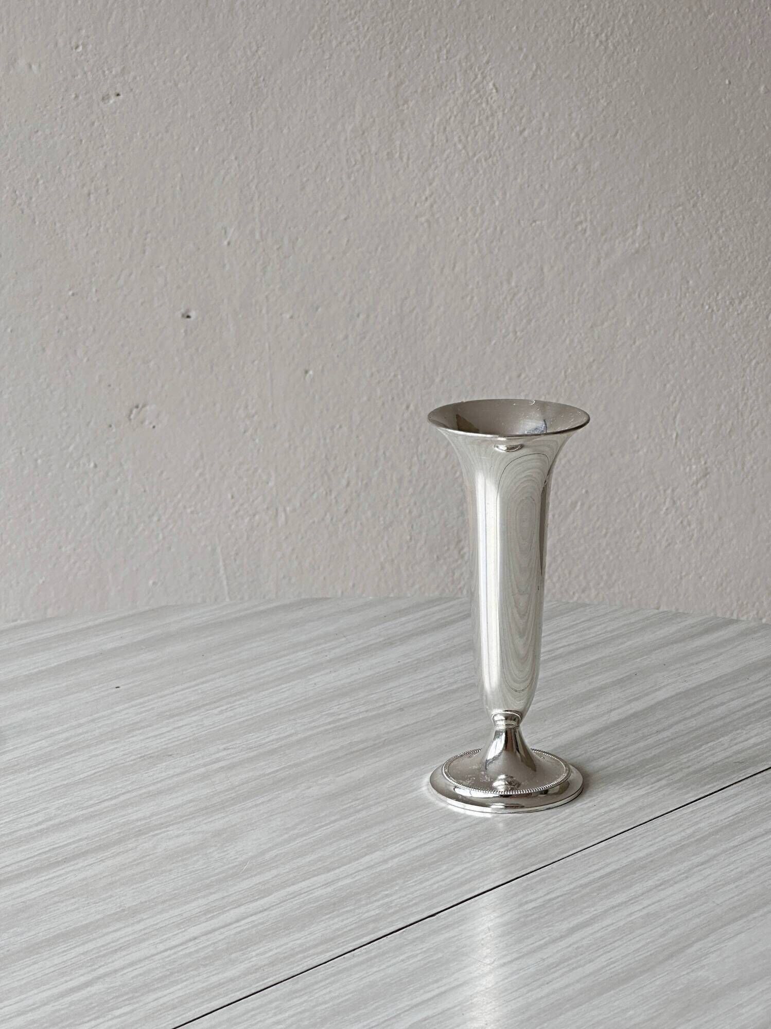 Light silver metal single-stem vase