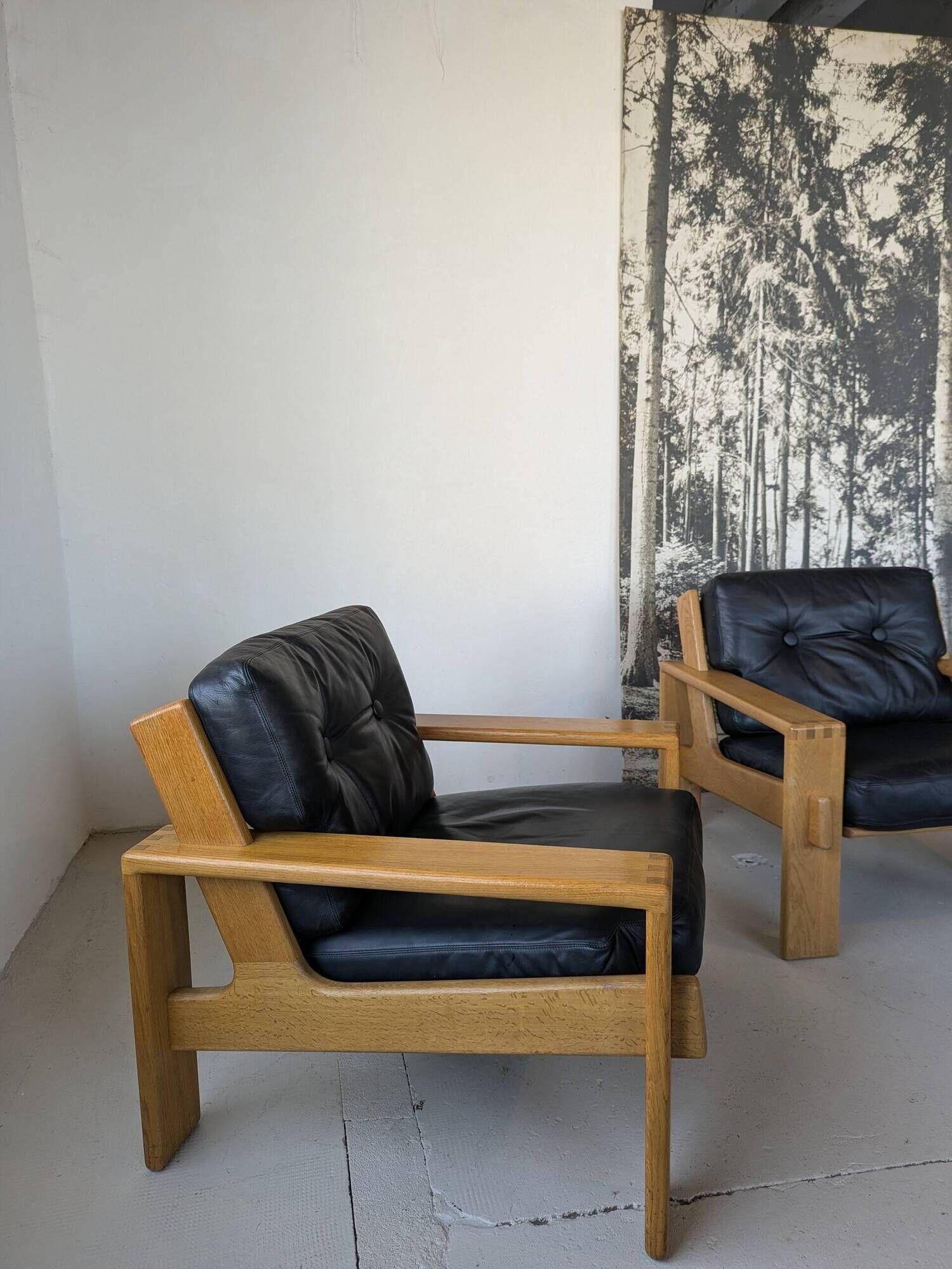 Pair of raw oak and leather armchairs by Esko Pajamies for Asko, Finland.