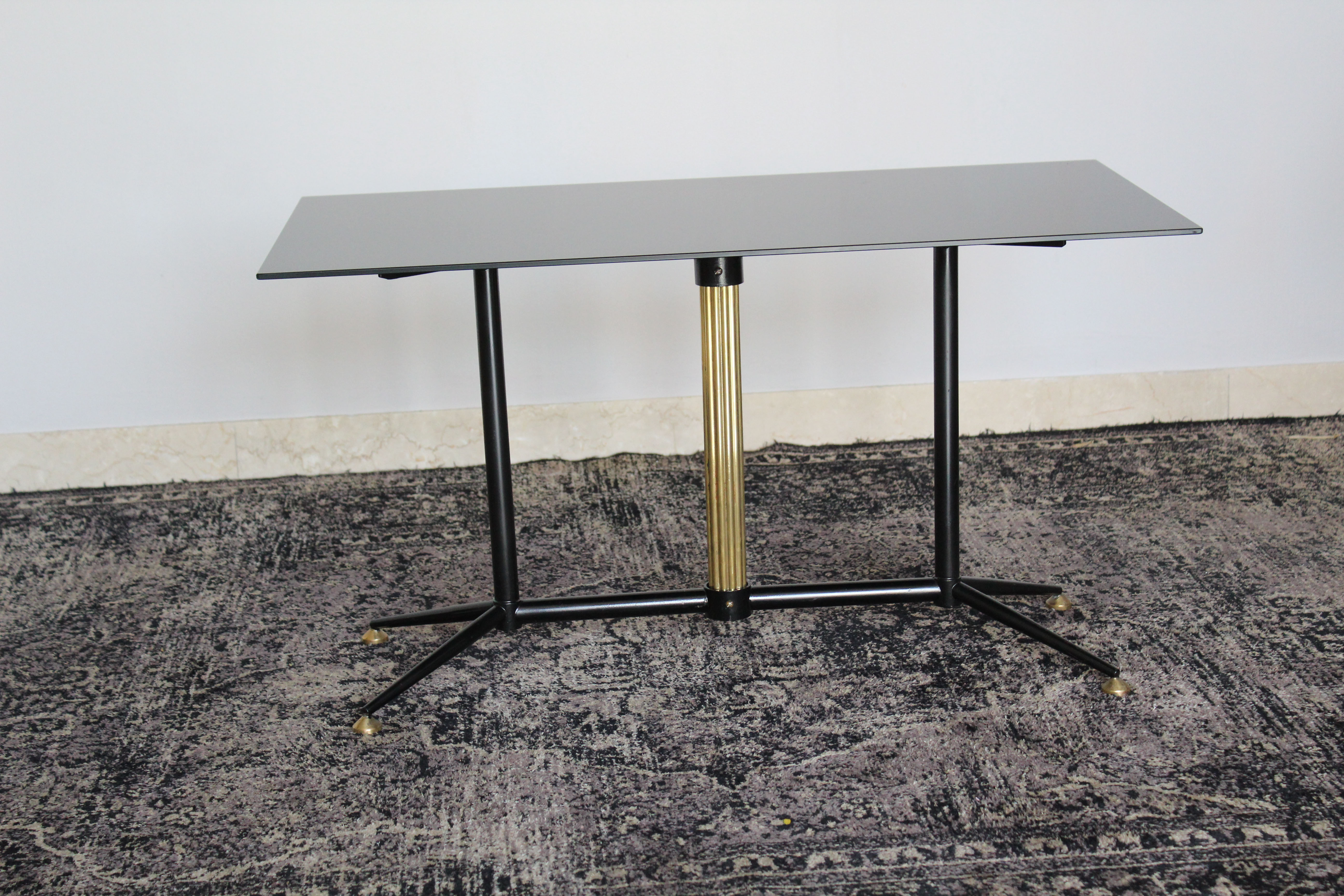 Coffee table in black glass lacquered brass and iron, Italy 50s