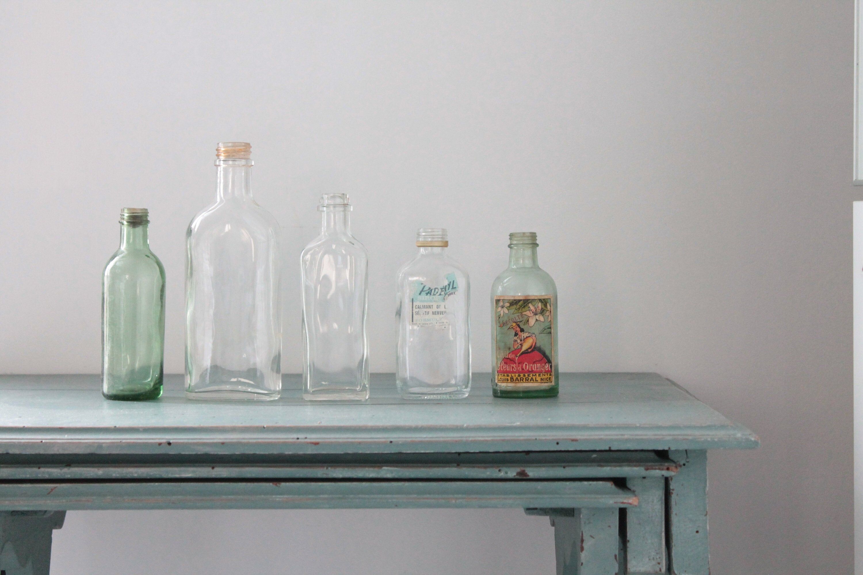 Collection de 7 Bouteilles anciennes en verre