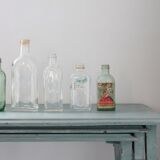Collection of 7 old glass bottles