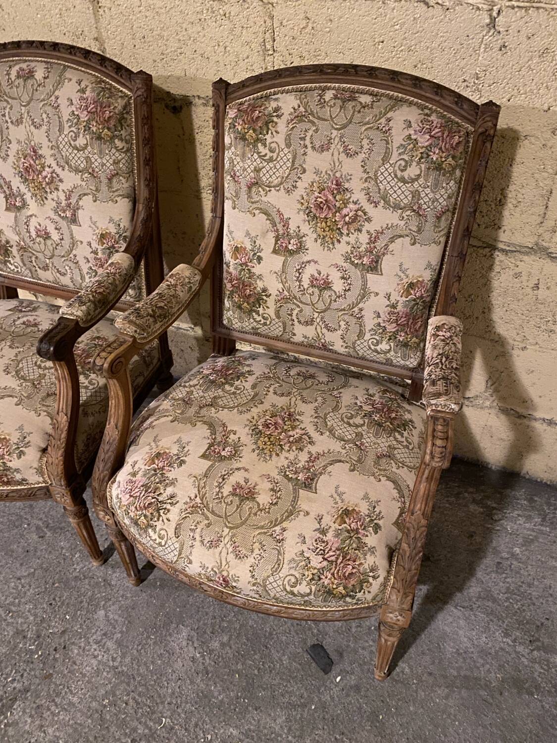 Pair of antique carved wooden armchairs