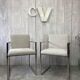 Pair of stainless steel armchairs from the 70s