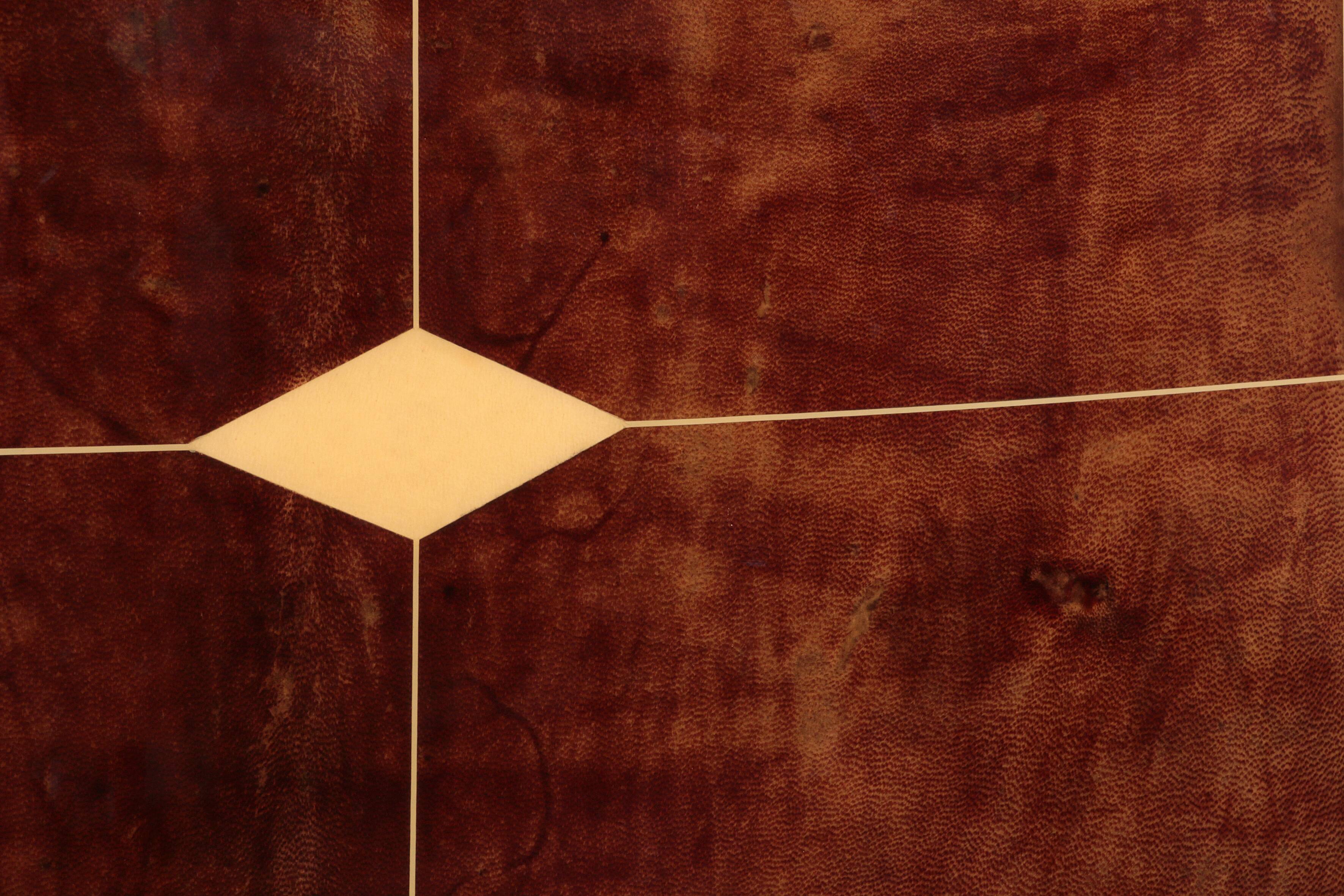 Iconic Aldo Tura brown goatskin bar cabinet with electric lift & mirror interior.