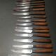 Old table knives and dessert knives, wooden handles, stainless steel blades