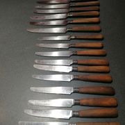 Old table knives and dessert knives, wooden handles, stainless steel blades