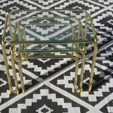 Nesting tables in gold-tone metal and glass