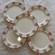 Set of 5 flat plates with ethnic patterns in terracotta.