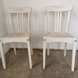 Set of 6 mismatched white chairs