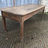 Antique farmhouse table in solid oak with tapered legs and 1 drawer at the end.