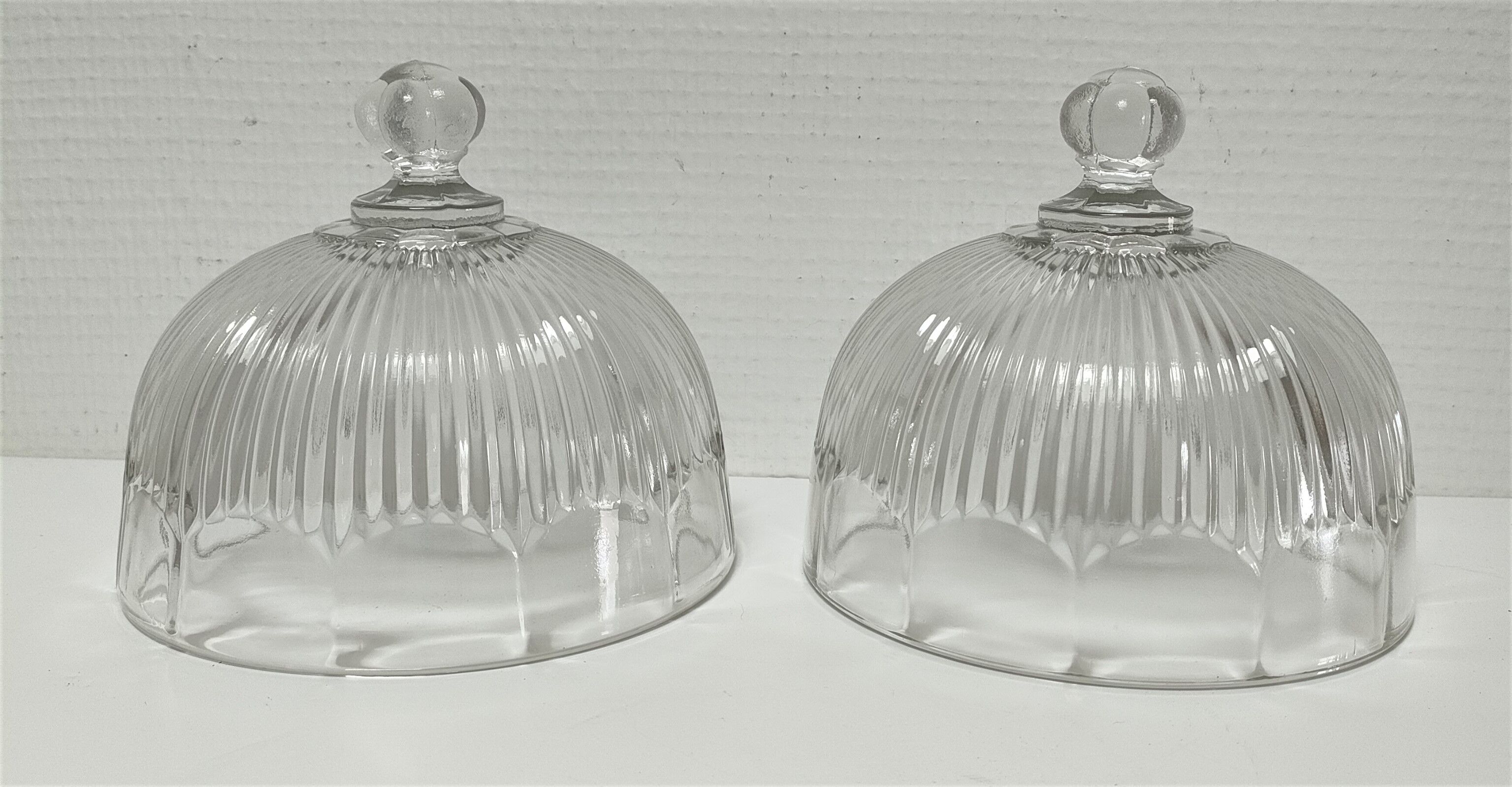 Two cheese bells molded pressed glass striated Art Deco style early twentieth century