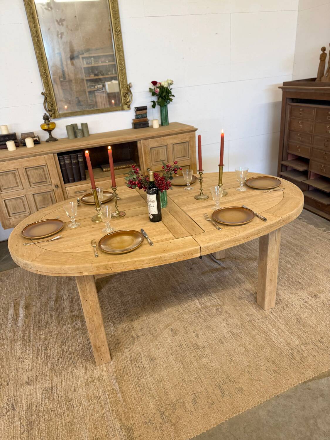 Oval farmhouse table in solid oak with extensions.