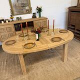 Oval farmhouse table in solid oak with extensions.