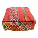 Handwoven floor pouf in natural wool