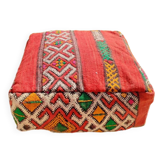 Handwoven floor pouf in natural wool