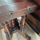 Coffee table in walnut with maple inlays and wheels